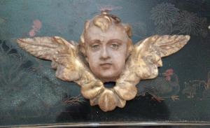 Antica scultura testa alata cherubino putto angelo
